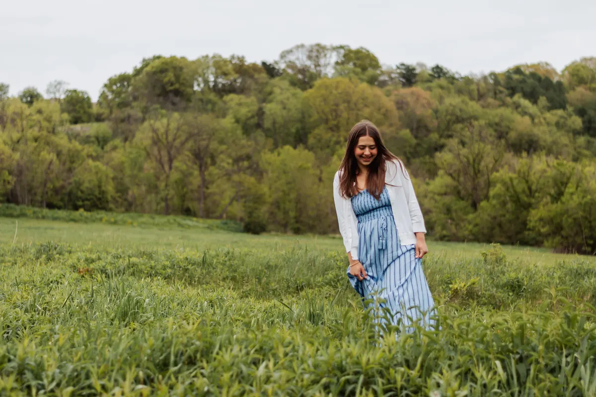 Senior walking through an open field in Upper St. Clair